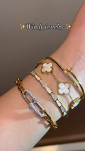 Luxurious Layered Gold-Toned Bracelet Stack with Clover, Pave, and Nail Designs