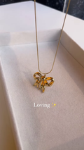 Elegant Gold-Toned Bow Pendant Necklace – Delicate and Charming