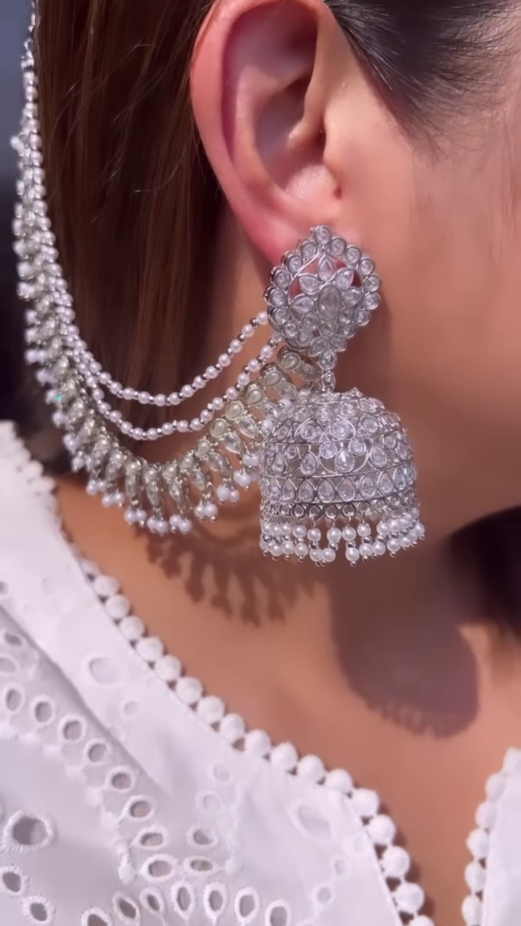 Dazzling Silver-Toned Jhumka Earrings with Multiple Chains and Pearl Embellishments