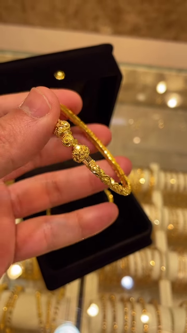 Exquisite Gold-Toned Bangle with Intricate Traditional Filigree and Textured Detailing