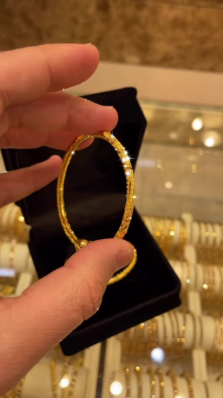 Exquisite Gold-Toned Bangle with Intricate Traditional Filigree and Textured Detailing