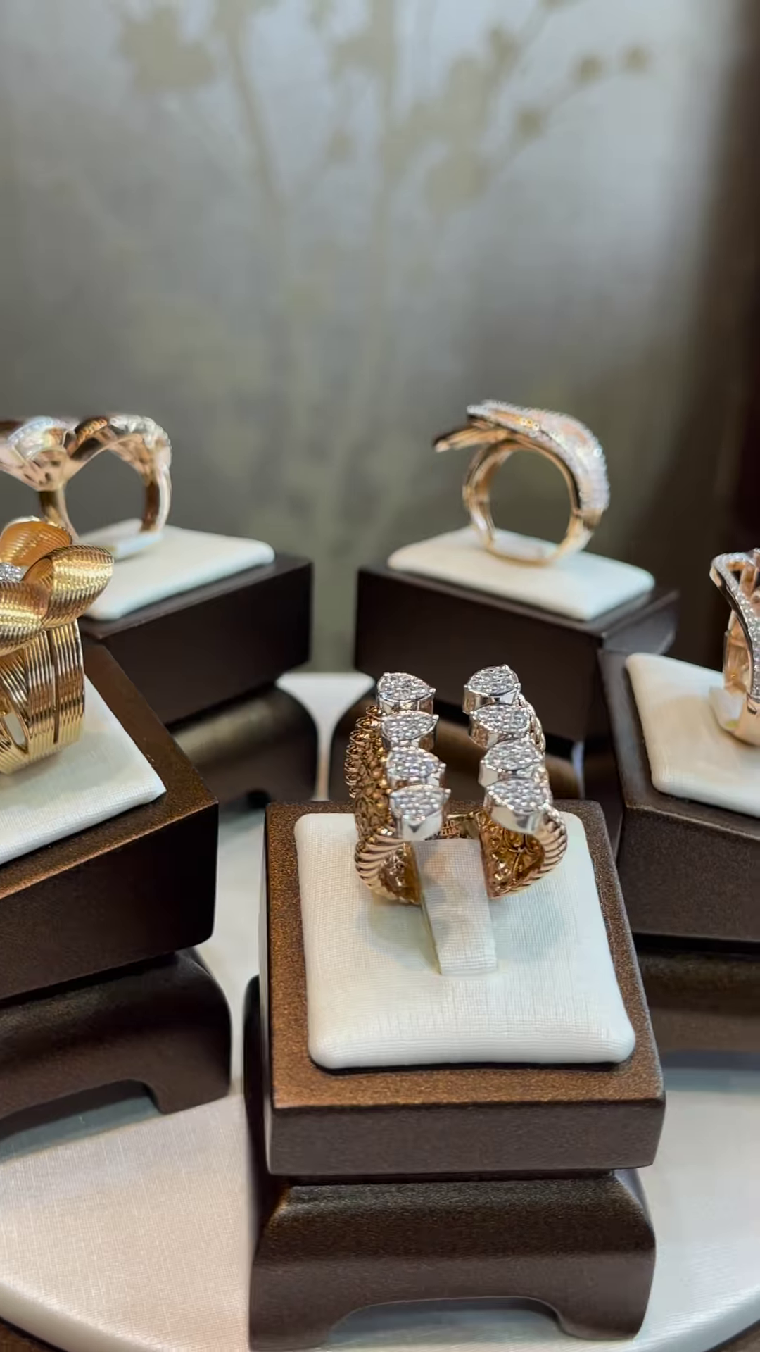 Elegant Gold-Toned Sculptural Bow Ring with Dazzling Clear Gemstone Accents