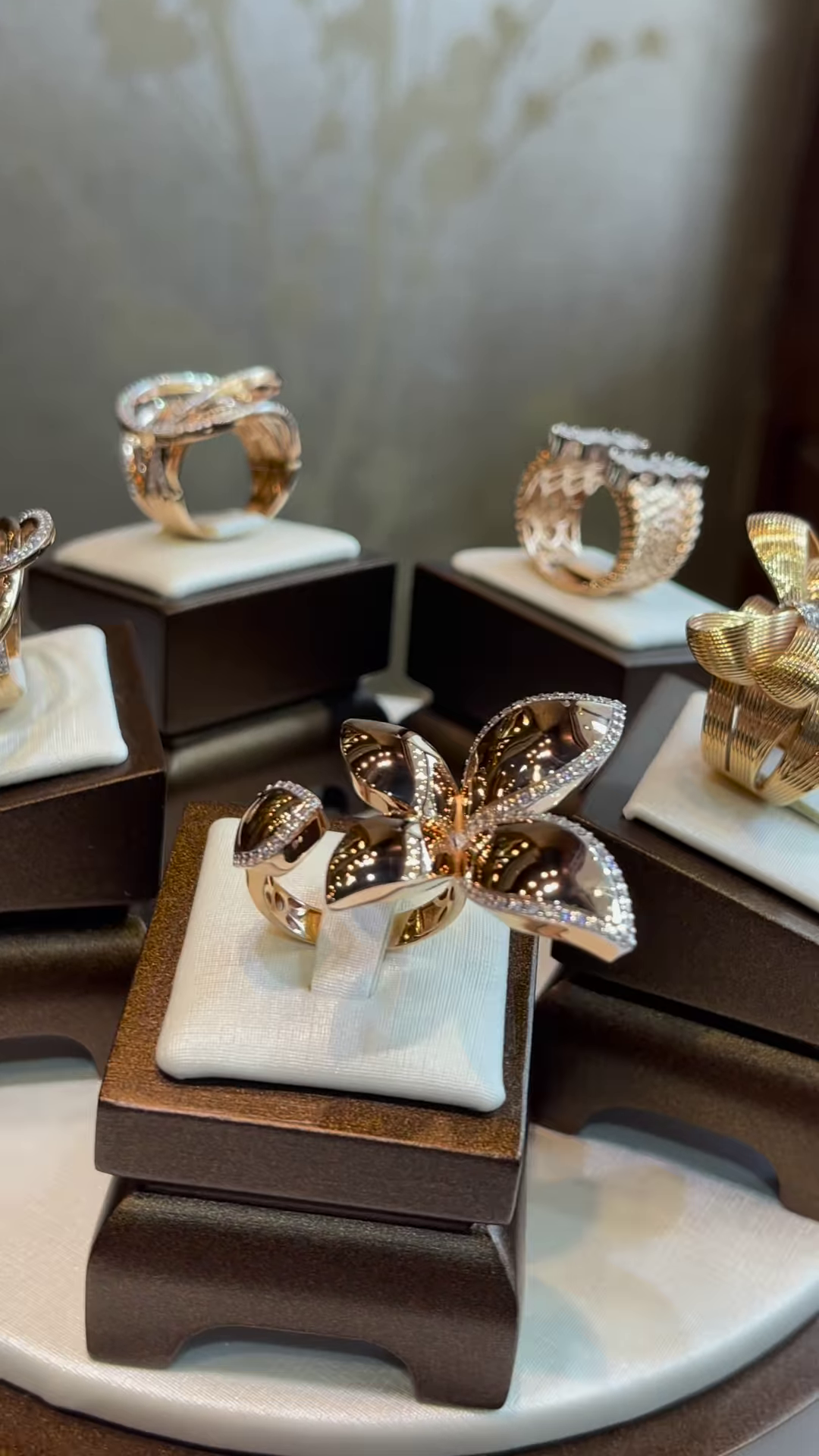 Elegant Gold-Toned Sculptural Bow Ring with Dazzling Clear Gemstone Accents