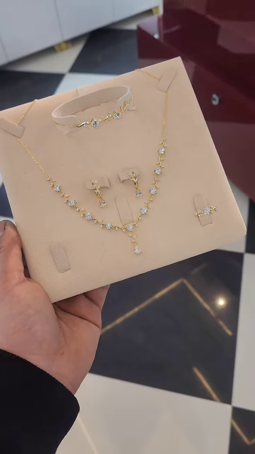 Elegant Gold-Toned Four-Piece Jewelry Set with Dazzling Floral Cluster Gemstones