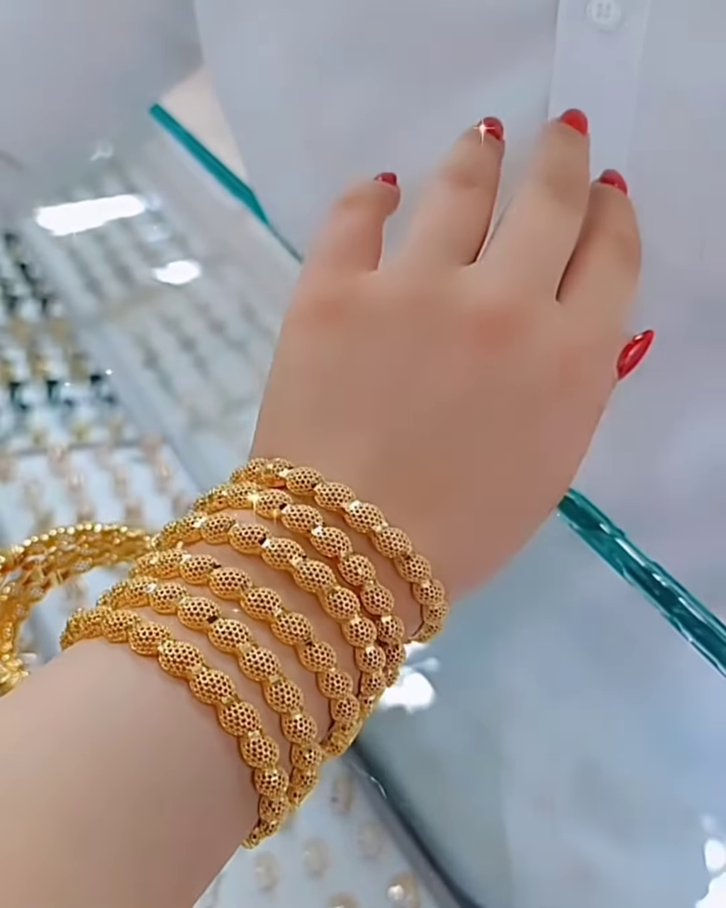 Radiant Gold-Toned Bangle Set with Intricate Spherical Beaded Texture